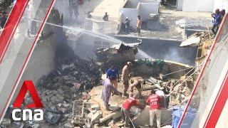 Scene where Pakistan International Airlines PK8303 crashed among houses in Karachi