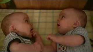 Twin Baby Boys Laughing at Each Other