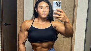 Beautiful muscular woman flexing muscles