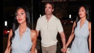 Nicole Scherzinger is the epitome of chic in a blue striped shirt dress as she and fiancé Thom Evans