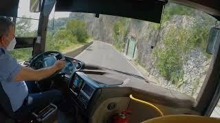 Bus trip through narrow cliff Italy