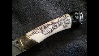 Decoration of the knife handle. Scrimshaw