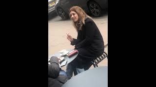 Italian girl smoking a full cig at a cafe