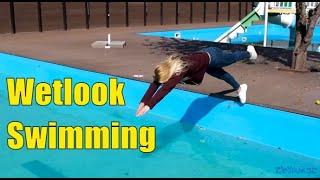 Wetlook swimming in pool  Wetlook wetting girl