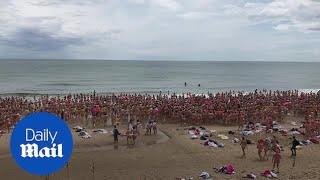 Hundreds of women strip off for charity