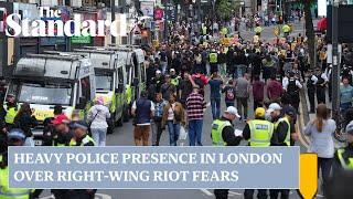 UK riots heavy police presence in London over fears right-wing activity could spark chaos