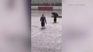 Christian Eckes wading through the flood waters on the North Wilkesboro Speedway track