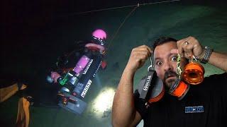 Diver Reacts to cave diving line work with a DPV
