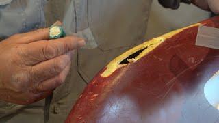 Repairing a Hole in a Canoe.