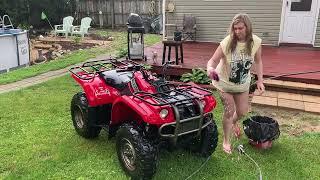 Curvy girl washing four wheeler