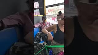 Old guy messing with a old lady on the bus