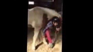 Horse hugging girl .