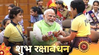 Children tie Rakhi to PM Modi on Raksha Bandhan