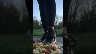Girl in Nike air max crush food. ASMR trample . Apple crush. Size 38 eu.