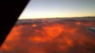 Sun rise under the clouds at FL280