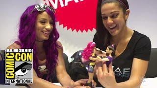 Sasha Banks and Bayley play with their new WWE Superstars dolls