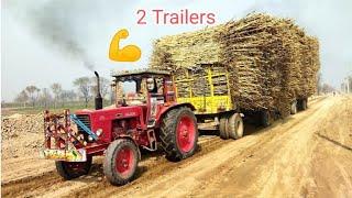 Powerful Tractors for pulling heavy loaded sugarcane trailers at road under construction