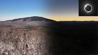 Eclipse shadow sweeps over mountains