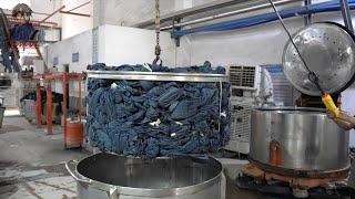 The process of producing jeans in large quantities. The worlds largest jeans production base