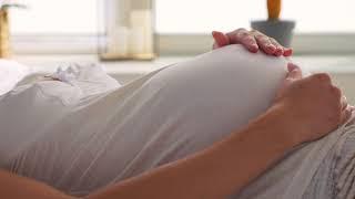 Baby moving inside belly of pregnant woman