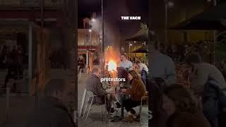 French diners drink wine in fire and protestors eat fancy #shorts