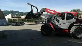 MANITOU telehandler stacking bales