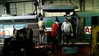 fixing top to the locomotive . locomotive top.locomotive repair in Diesel loco shed . locomotive