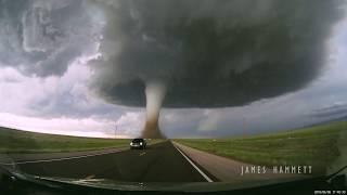 Storm chasing dashcam Tornado crossing the highway Laramie Wyoming