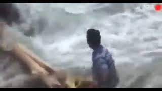 Man saves a donkey from raging flood waters