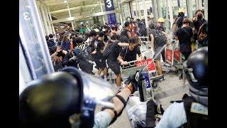 Powerful POLICE men Crack Down On PROTESTERS Occupying Hong Kongs Airport
