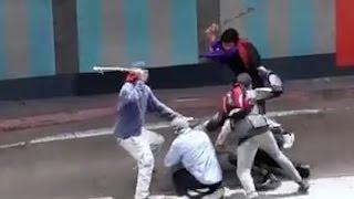 Venezuelan protesters beat female officer with clubs in chilling video