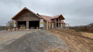 Huge cedar trees hold this log home up on top of an ICF basement