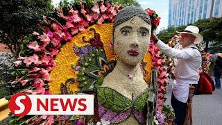 Rain does not stop Colombian parade celebrating art of floristry