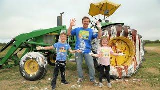 Making a real tractor SUPER dirty and washing it  Tractors for kids