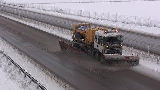 Scania plow trucks clearing the motorway