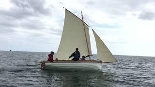 Andys Musgroves 14’6” Ilur glued clinker sloop rigged sailing boat out at sea launch day