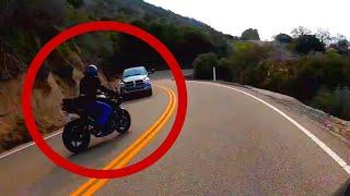 Biker almost collides on a winding mountain road