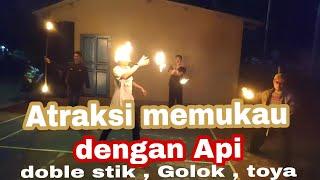 Atraksi Memukau dengan API Doble stik  Golok  Toya