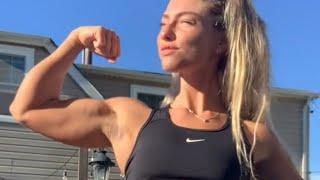 Beautiful muscle girl flexing