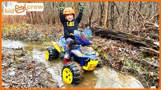 Playing in the mud on ATV and making trail in woods building bridge. Educational  Kid Crew