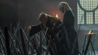 Prince Daemon help King Viserys up the stairs of the iron Throne   House Of The Dragon.