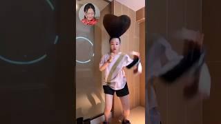 Chinese Lady Styles Hair into Heart