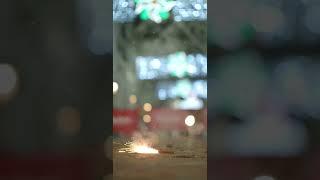 Vertical video - teenager lights a firecracker