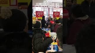 Fighting over toilet tissue in supermarket