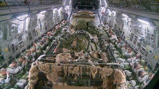 C-17 Heavy and Personnel Drop Onto the Aircraft and Takeoff