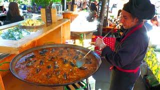 Spanish Guy cooks Paella with much Love at Market  Street Food in Berlin Germany