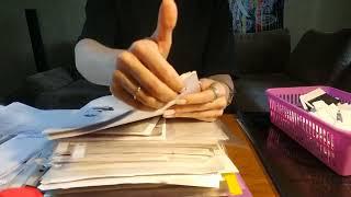 ASMR sorting and tearing paper accompanied by voice