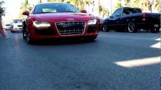 Red Audi R8 driving on Ocean Drive in Miami Beach