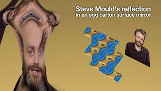 Steve Moulds reflection in an egg carton surface mirror.