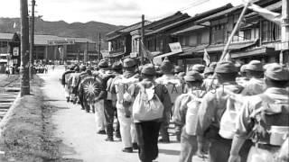 Repatriates march on foot and Japanese nurses vaccinate them in Japan during a Ja...HD Stock Footage